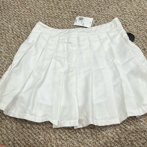 White tennis skirt from Forever 21. Never worn. Size Large